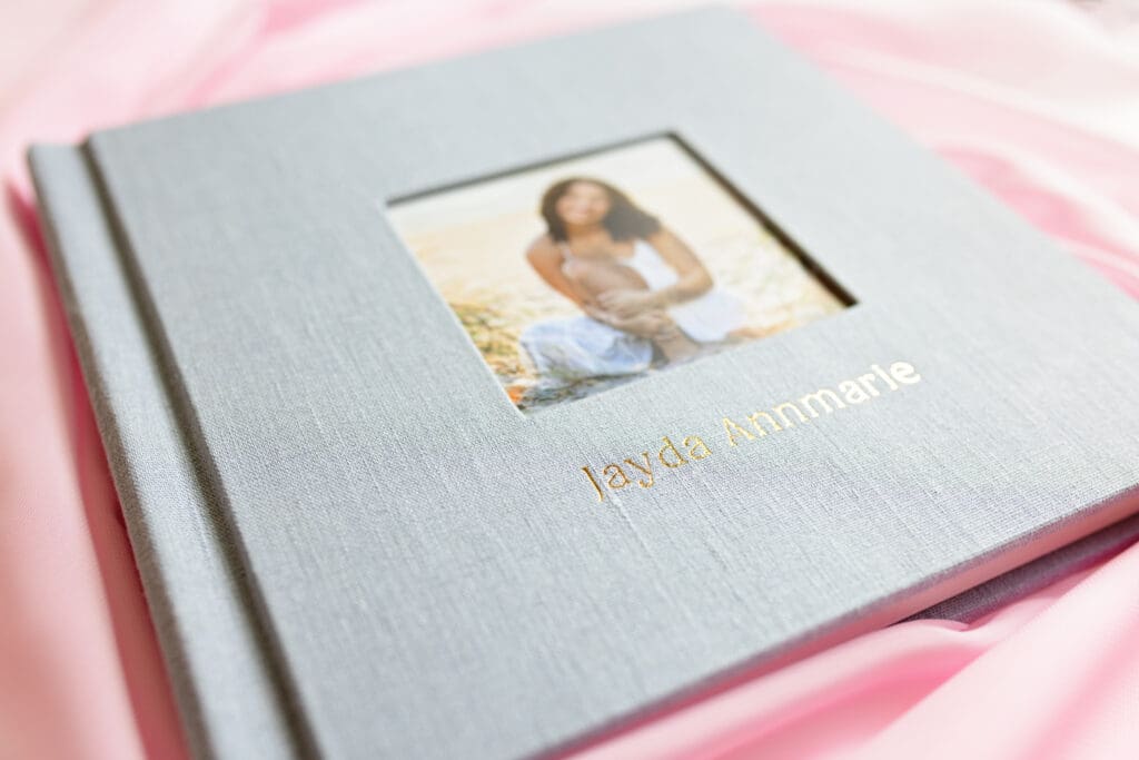 Detail shot of gold foild embossing on an heirloom senior album featuring premium materials and handcrafted design by Orlando senior photographer.